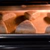Lấy bột ra măt phẳng, dùng tay nhào cho đến khi thành khối bột mượt và mịn. Nặn bột thành hình tròn với đường kín khoảng 20cm, dày cở 2 - 3cm. Chia bột thành  6 phần bằng nhau và cắt ra. Đặt bánh lên khay nướng, phết sữa tươi lên trên bánh và cho vào lò nướng từ 10 - 15 phút đến khi thấy bánh vàng đẹp mắt thì lấy bánh ra để nguội là có thể ăn được.