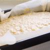 Sau đó rây bột mì vào trộn đều với hỗn hợp. Trút hỗn hợp bột bánh vào 3/4 khuôn có lót sẵn giấy nến, gõ nhẹ cho bột dàn đều. Cho khuôn bánh vào lò nướng từ 50-60 phút cho đến khi bánh chín, thử khô tăm là được.