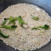 Cho gạo, lá chanh và sả cắt lát vào chảo rang lửa hơi thấp. Khi thấy gạo vàng thơm thì tắt bếp, để nguội. Sau đó cho gạo, lá chanh, gừng, muối và ớt khô cắt nhỏ vào máy xay nát. Cho gạo rang ra âu.